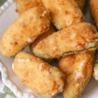 Jalapeño Poppers · Crispy cream cheese filled jalapeños with choice of dipping sauce.