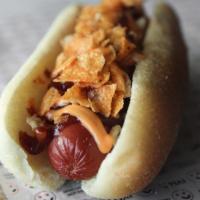 Texas Roundhouse · Chicken dog topped with battered crispy onions, BBQ sauce and spicy cheddar sauce and BBQ ch...