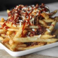 Brisket Fries · Crispy fries loaded with pulled pork, pepper jack cheese, and sweet bbq sauce.