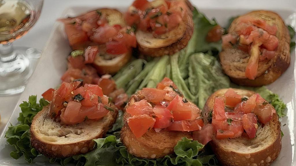 Bruschetta · Crostini's Topped with Basil, Tomatoes and Garlic. Drizzled w/Olive Oil & Balsamic Vinegar.