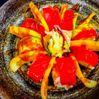 Spicy Orange · Spicy crab meat, shrimp tempura covered with tuna, avocado with sliced oranges.