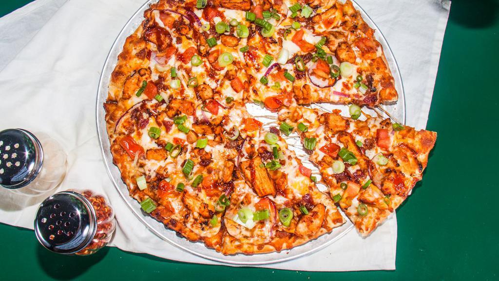 BBQ Chicken (Medium) · Backyard BBQ meets handmade pizza grilled white meat chicken, crisp bacon, cheddar, tomatoes, red, and green onions and our sweet and tangy BBQ sauce.