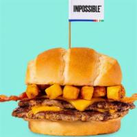 Impossible™ Chris Style · Smashed crispy Impossible™ patty with house seasoning, American cheese, bacon, topped with c...