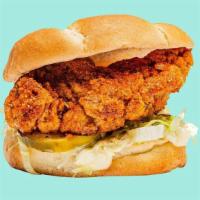 Nashville Hot Chicken Tender Sandwich · Topped with mayo, ketchup, shredded lettuce and pickles