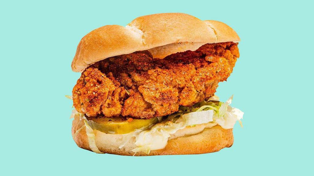 Nashville Hot Chicken Tender Sandwich · With mayo, ketchup, shredded lettuce and pickles.
