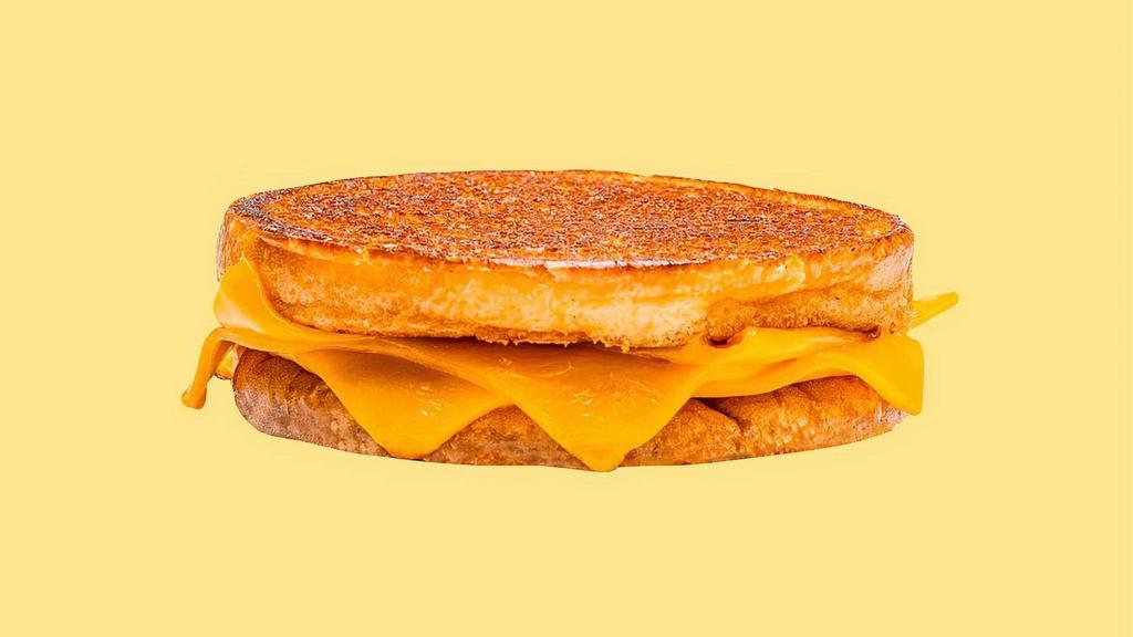 Karl's Grilled Cheese · 3 slices of American cheese griddled crisp on an inverted bun