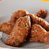 Sesame Garlic Wings · Lightly breaded and fried to perfection. Tossed in a Sesame Garlic Sauce.