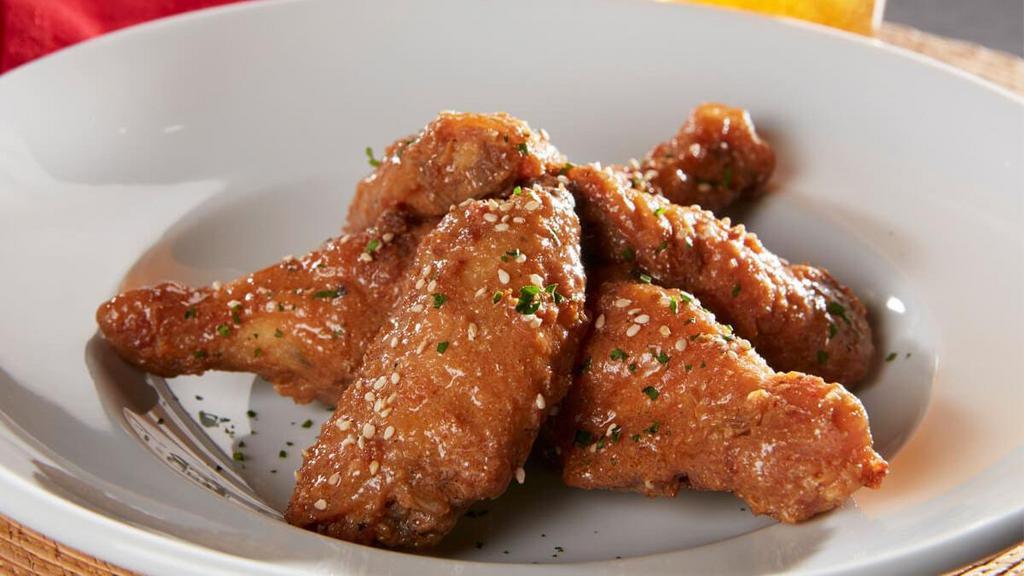 Wings Appetizer · Lightly breaded and fried to perfection. Tossed in your choice of Sesame Garlic, Black Pepper Teriyaki or Spicy Sauce.