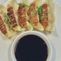 Pan Fried Beef Gyoza Dumplings · Spicy sesame soy dipping sauce.