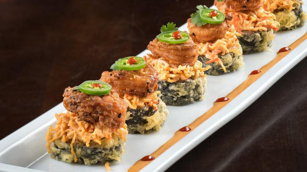 Chili Shrimp Roll · Krab† and cream cheese rolled and lightly tempura battered, topped with spicy krab† mix, crispy shrimp, cilantro and jalapeño; served with spicy mayo and Sriracha