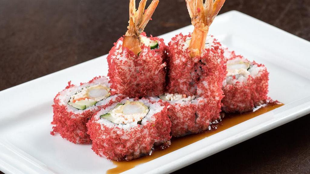 Crunchy Shrimp Tempura Roll · Shrimp tempura, spicy krab† mix and cucumber rolled and topped with red tempura bits; served with sweet eel sauce