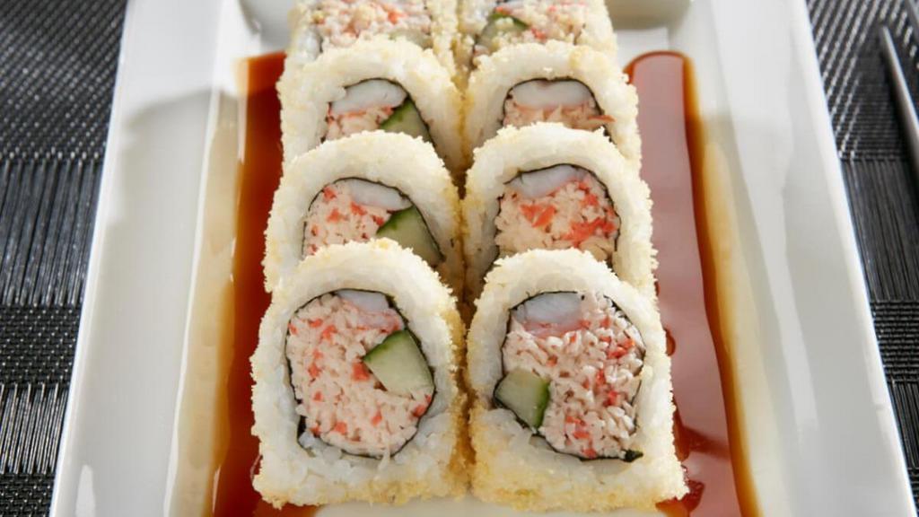 Tootsy Maki Roll · Krab† mix, shrimp and cucumber rolled and topped with crunchy tempura bits; drizzled with sweet eel sauce