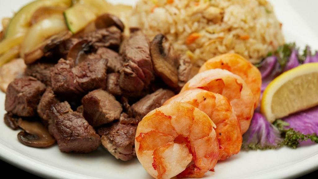 Filet Mignon & Colossal Shrimp · Filet Mignon and colossal shrimp served with sauteed zucchini, mushrooms, and onions,“RA”ckin’ Fried Rice and homemade mustard and ginger dipping sauces.