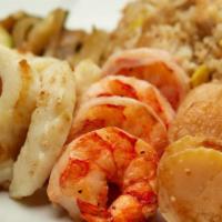 Calamari, Scallops & Colossal Shrimp  · Calamari, scallops and colossal shrimp served with sauteed zucchini, mushrooms, and onions,“...