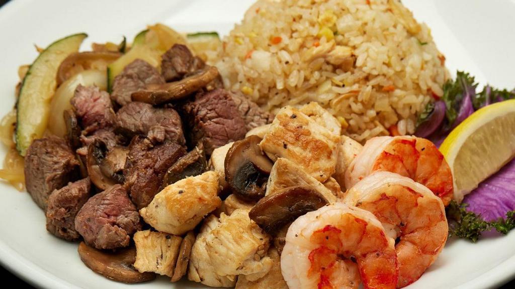 Filet Mignon, Chicken & Colossal Shrimp · Filet Mignon*, chicken breast and colossal shrimp grilled with lemon. Served with hibachi vegetables, “RA”ckin’ Fried Rice and homemade dipping sauces.