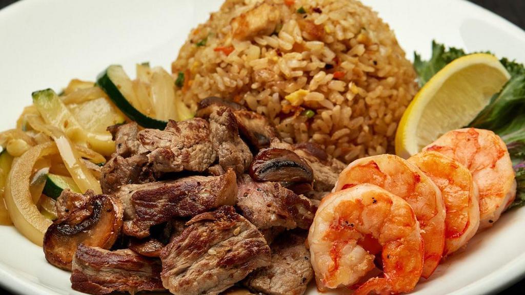 Ny Steak & Colossal Shrimp · Hibachi steak* and grilled colossal shrimp lightly seasoned and grilled to your specification. Served with hibachi vegetables, “RA”ckin’ Fried Rice and homemade dipping sauces.