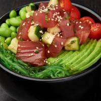 Tuna Poke Bowl · Tuna, cucumber and green onions mixed in poke sauce; served with grape tomatoes, avocados, e...