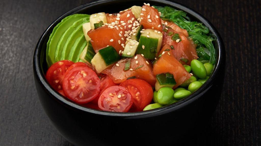 Salmon Poke*  · Salmon, cucumber and green onions mixed with poke sauce; served over rice (510 cal) or mixed greens (20 cal) with miso soup (35 cal) with grape tomatoes and avocados, edamame and seaweed salad; topped with sesame seeds.