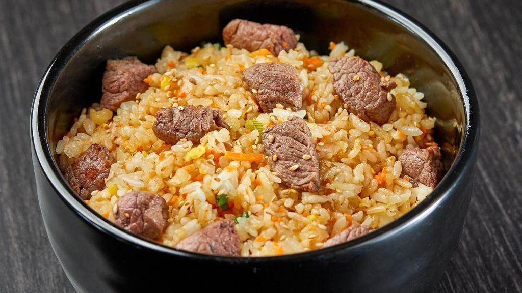 Rackin' Steak Rice · A classic fried rice recipe. Steak, rice, egg and chopped vegetables.. Choose your serving size.
