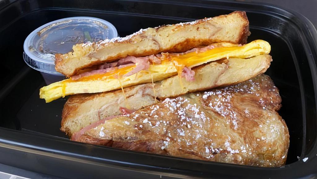 Freakin French Toast · Eggs, cheddar cheese turkey bacon all nested in our cinnamon swirl bread dipped in our golden good batter.