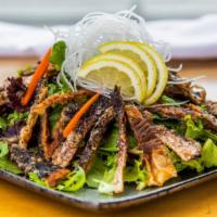 Salmon Skin Salad · salmon skin in spring mix salad with house special dressing