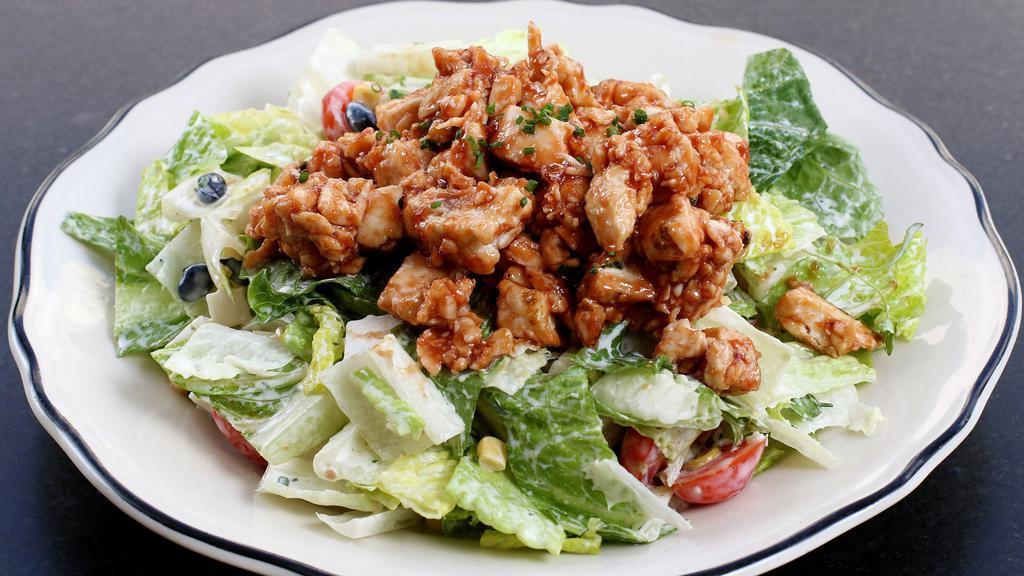 The Cowboy · Romaine lettuce, black beans, corn, jicama, cherry tomatoes, BBQ chicken, and house made ranch dressing.