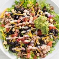 7 Layer Bowl · Our play on the classic 7 layer burrito: Layers of brown rice, lettuce, ranchero beans, ched...