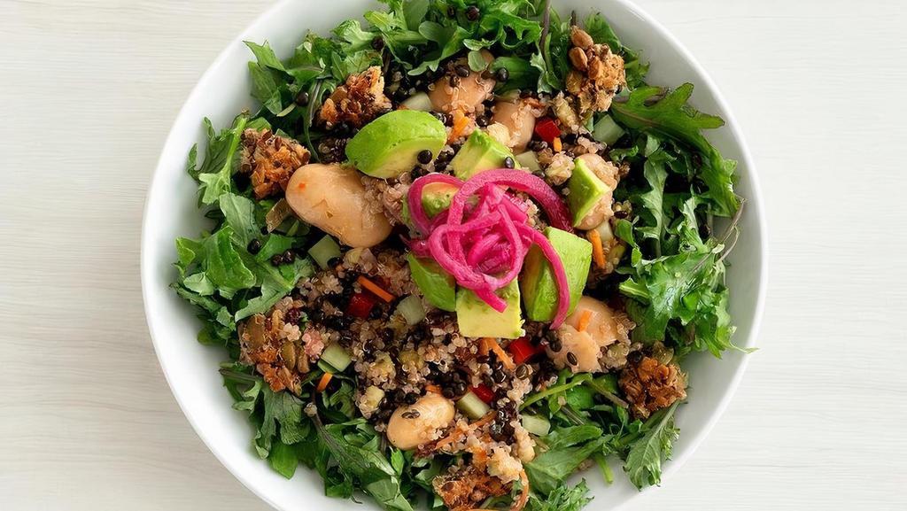 Kale + Quinoa Power Salad  · Organic quinoa served on a bed of marinated chopped kale with cucumber, carrot, avocado, dried currants, bell peppers, gigande beans, pickled onions and 3-seed crunch served with a mango-lemon vinaigrette  | 530-810 cals | Gluten-friendly..