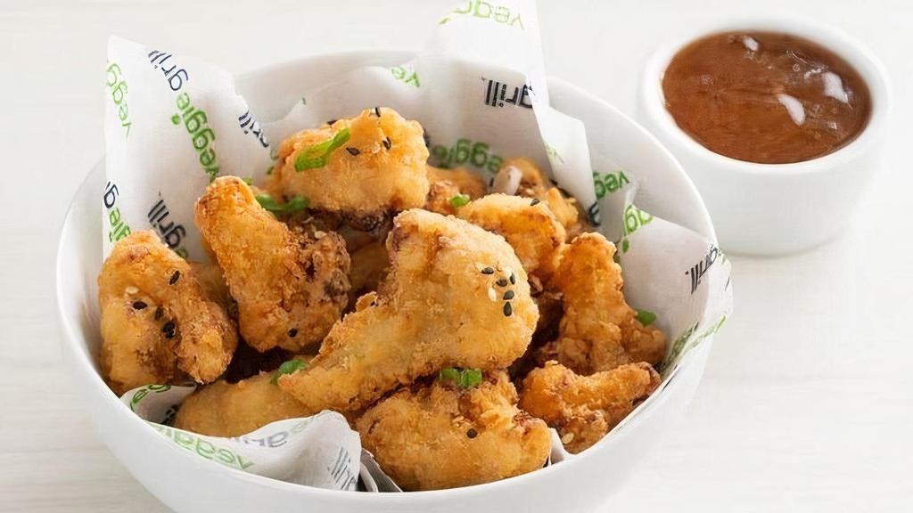 Crispy Cauliflower · Serves 2 | Tempura battered cauliflower topped with sesame seeds and green onions  | choice of buffalo or orange dipping sauce  | 330-340 cals
