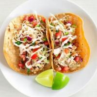 Two Taco Plate · Serves 2 | Baja fish tacos with creamy jalapeno slaw, pico de gallo and a lime served on war...
