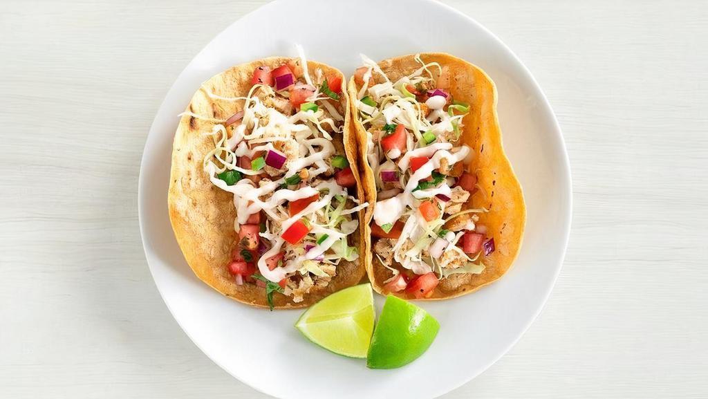 Two Taco Plate · Serves 2 | Baja fish tacos with creamy jalapeno slaw, pico de gallo and a lime served on warm corn tortillas  | Sub crispy chickin - no charge | 180-190 cals