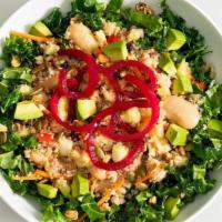 Kale + Quinoa Power Salad  · Organic quinoa served on a bed of marinated chopped kale with cucumber, carrot, avocado, dri...