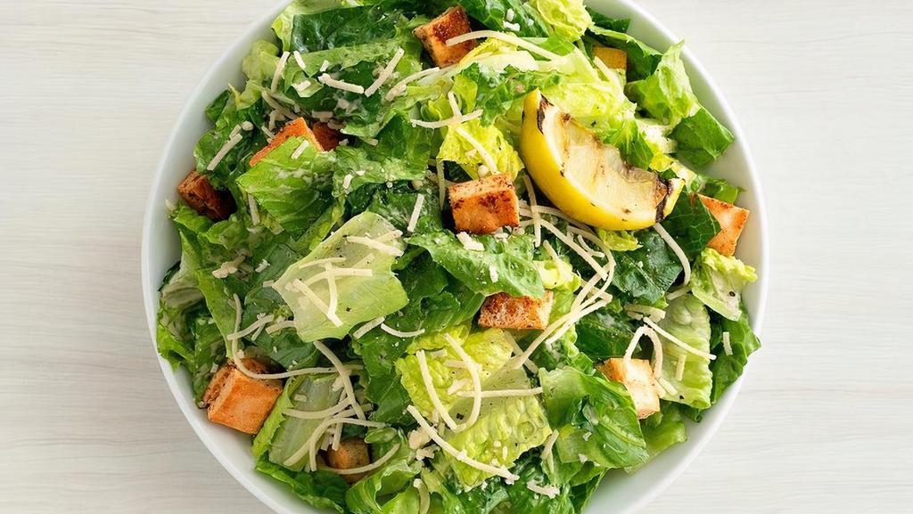 Classic Romaine Caesar  · Romaine hearts tossed in our signature Caesar dressing with parmesan, flatbread croutons and grilled lemon | Add crispy chickin' (+$3.95) | 100-480 cals