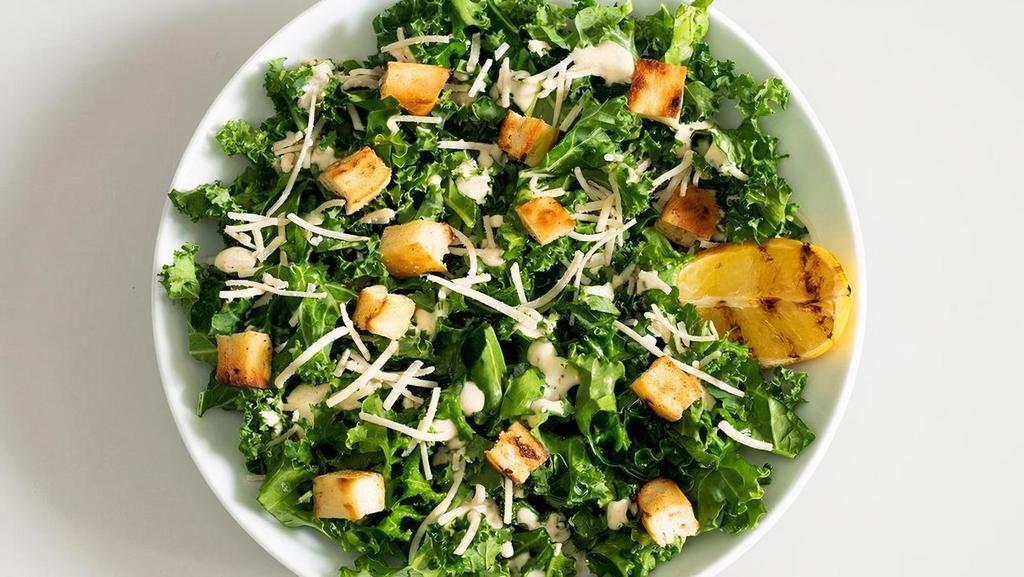 Kale Caesar  · Chopped kale tossed in our signature Caesar dressing with parmesan, flatbread croutons and grilled lemon | Add grilled tempeh (+$3.95) | 120-500 cals