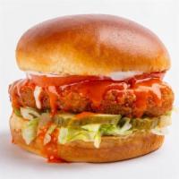 Crispy Buffalo Chick'N Sandwich · Crispy chick'n topped with creamy ranch, buffalo sauce, lettuce, tomato and  pickles on a br...