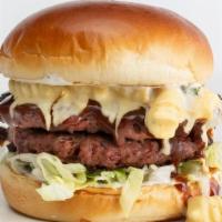 Double Bbq Mac Burger · Double Beyond Burger patties, lettuce, creamy ranch, BBQ sauce. Topped with mac + cheese and...