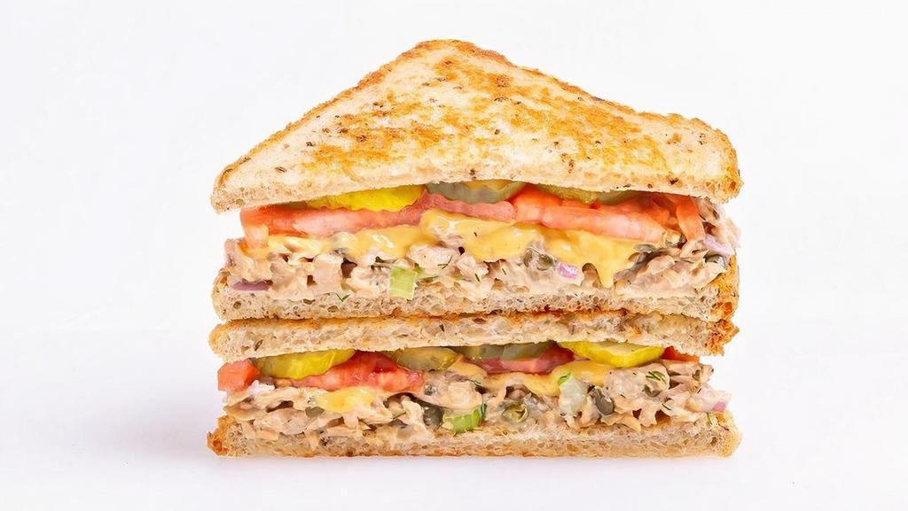 Tuna Melt · Good Catch™  tuna salad with diced onion, capers, celery, and fresh dill topped with American cheese, pickles and tomato on griddled rye bread | Make it a wrap - no charge  | 520-820 cals