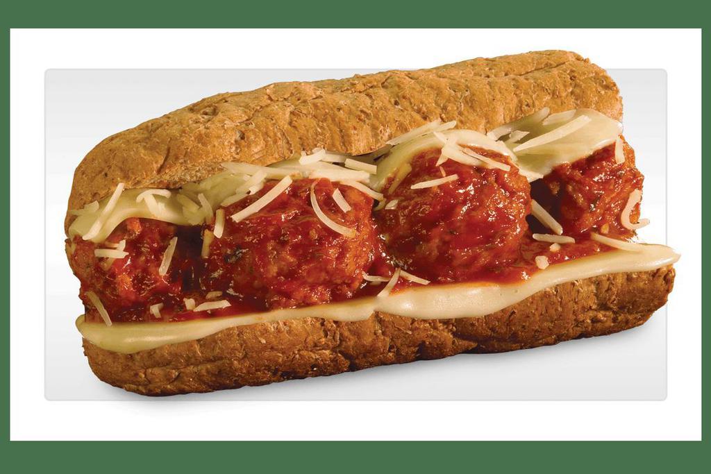 Meatball Parmigiana · Italian beef/pork blended meatballs smothered in a zesty marinara sauce with melted provolone and sprinkled with parmesan