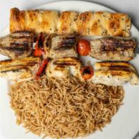 Chicken Kabob · Chicken breast charbroiled on skewer, served with browned rice.