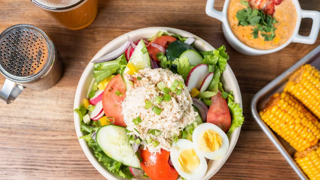 Salad with Crab Salad · Green salad, cherry tomatoes, cucumber, red onions, carrots and hard boiled egg with citrus vinaigrette. Add avocado  for an additional price.