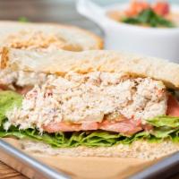 Crab Salad Sandwich · Mayonnaise, lettuce, tomato, pickle on french roll.