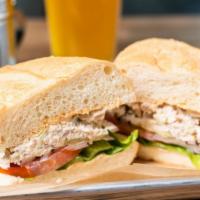 Albacore Tuna Salad Sandwich · Mayonnaise, lettuce, tomato, pickle on French roll.