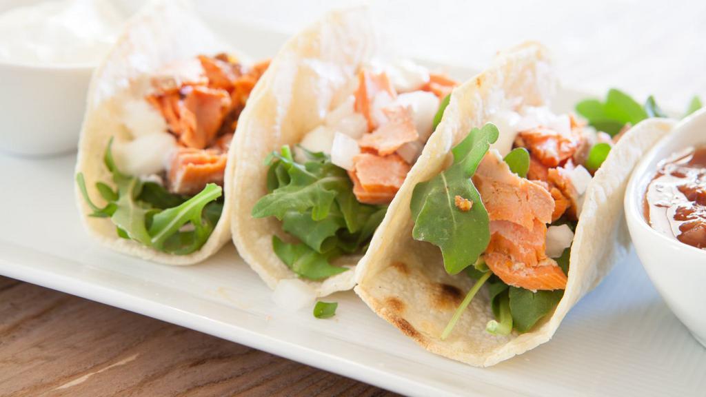 Grilled Salmon Taco · Delicious Taco made with Salmon, lettuce, and salsa.