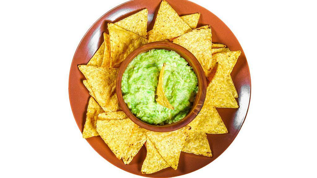Chips & Guacamole · Delicious plate of Tortilla chips, served with a side of Guacamole in customer's preference of size.