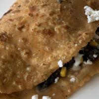 Quesadillas · Handmade organic corn tortilla filled with cheese and the filling of your choice (Sour cream...