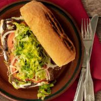 Tortas · Mexican Sandwich with mayo, refried beans, queso fresco, onion, lettuce and tomato and the f...