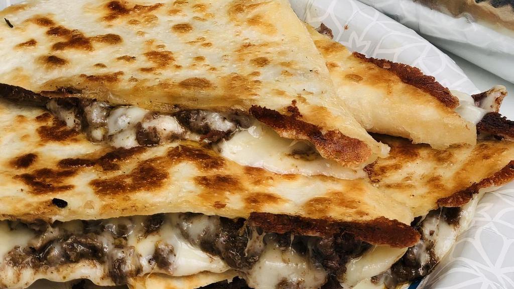 Regular Quesadilla · The classic Flour tortilla filled with cheese and your choice of meat.