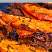 Quesabirria (1) · Two corn tortillas dipped in a flavorful birria oil grilled hard and stuffed with cheese, bi...