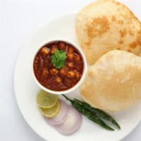 Channa Batura · A deliciously fragrant chickpea curry served with puri.