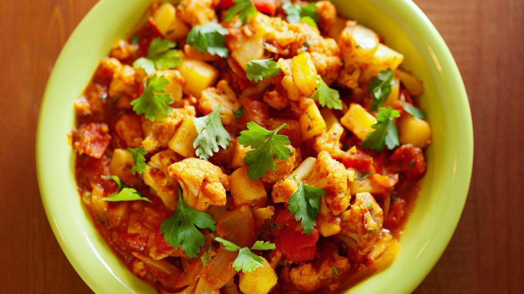 Aloo Curry · Spiced potato curry in a medley of fresh Indian herbs & seasonings.
